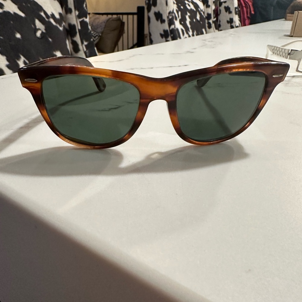Rayban Tortoise Wayfarer 11 sunglasses. Well loved.